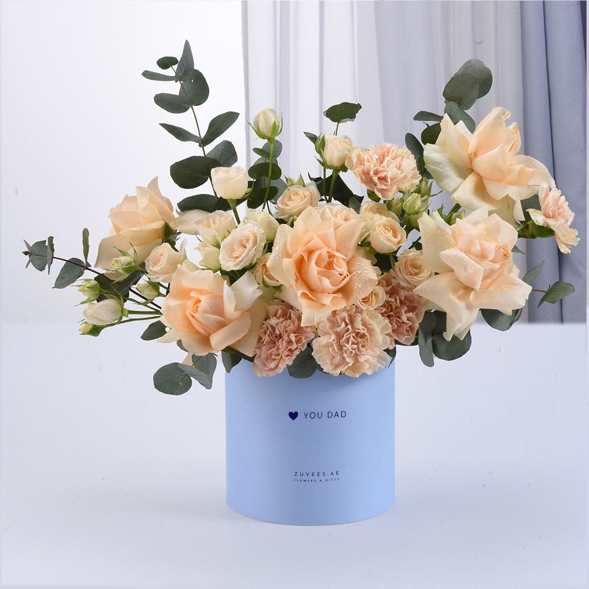 Soft peach roses and carnations in light blue “YOU DAD” gift box.