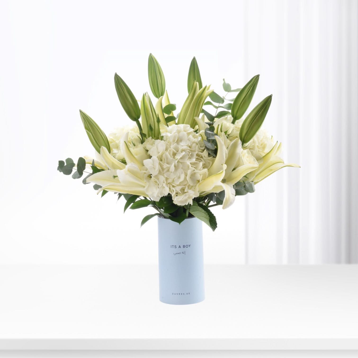Elegant white lilies and hydrangeas in light blue "It&
