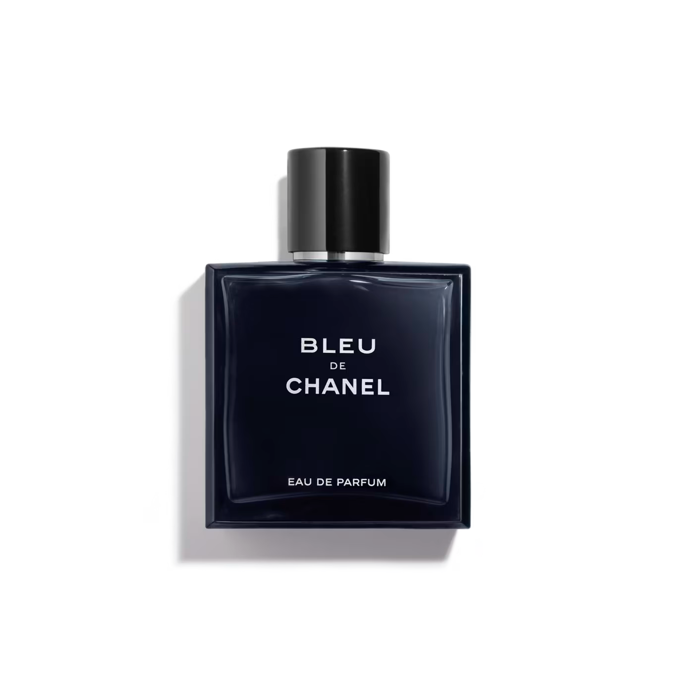 Sleek navy bottle with black cap, bold white "Bleu de Chanel" text.