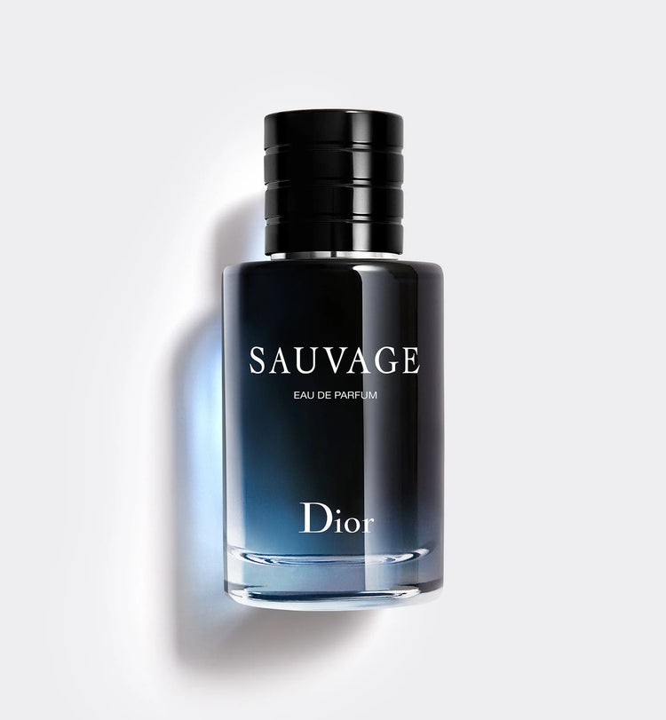 Dior Sauvage Eau de Parfum bottle, sleek black cap, gradient blue glass, minimalist white background.
