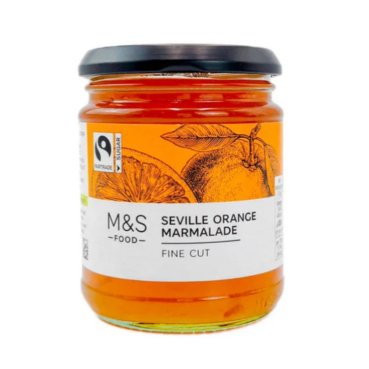Vibrant orange marmalade jar with fine-cut Seville oranges, Fairtrade certified, black lid.