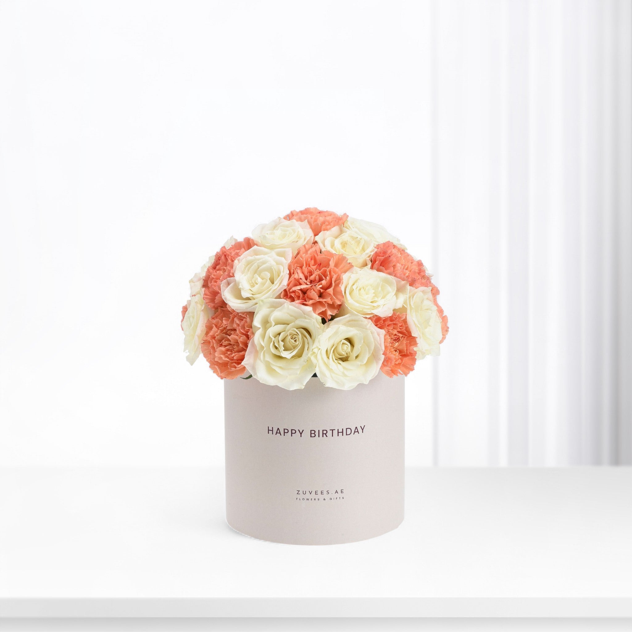 Coral and cream roses & carnations in minimalist "Happy Birthday" box.