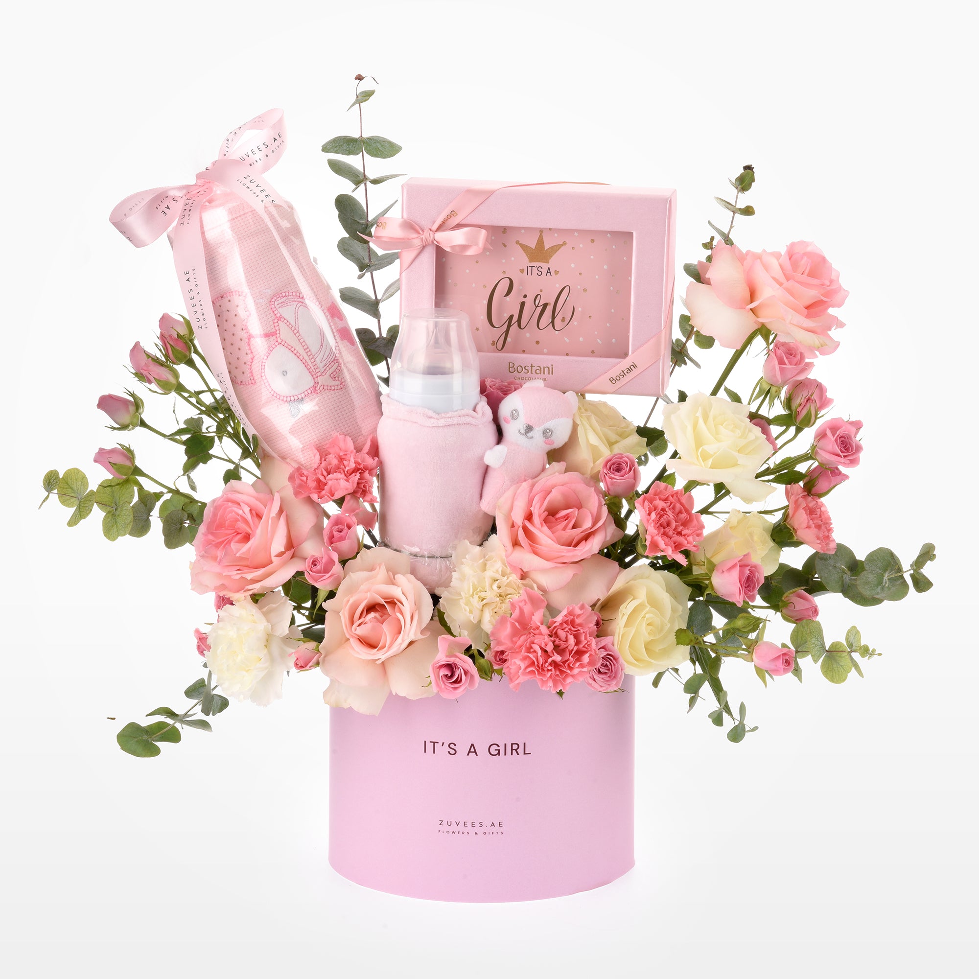 Pink floral baby shower gift basket with “It’s a Girl” theme and plush toys.