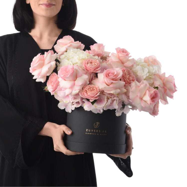 Elegant black box holds lush pink roses and hydrangeas, branded ZUVEES.AE.