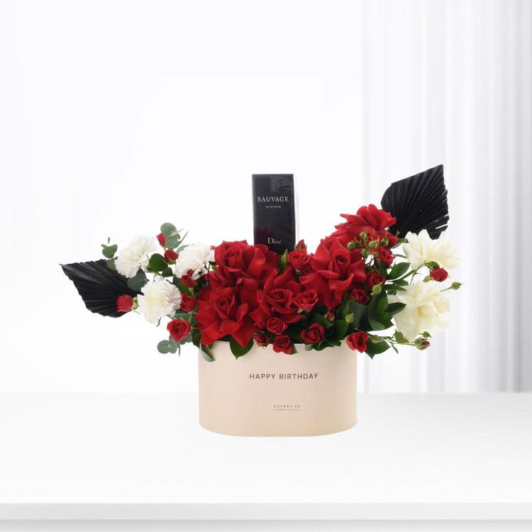 Elegant red and white floral arrangement with Dior Sauvage perfume in beige "Happy Birthday" box.