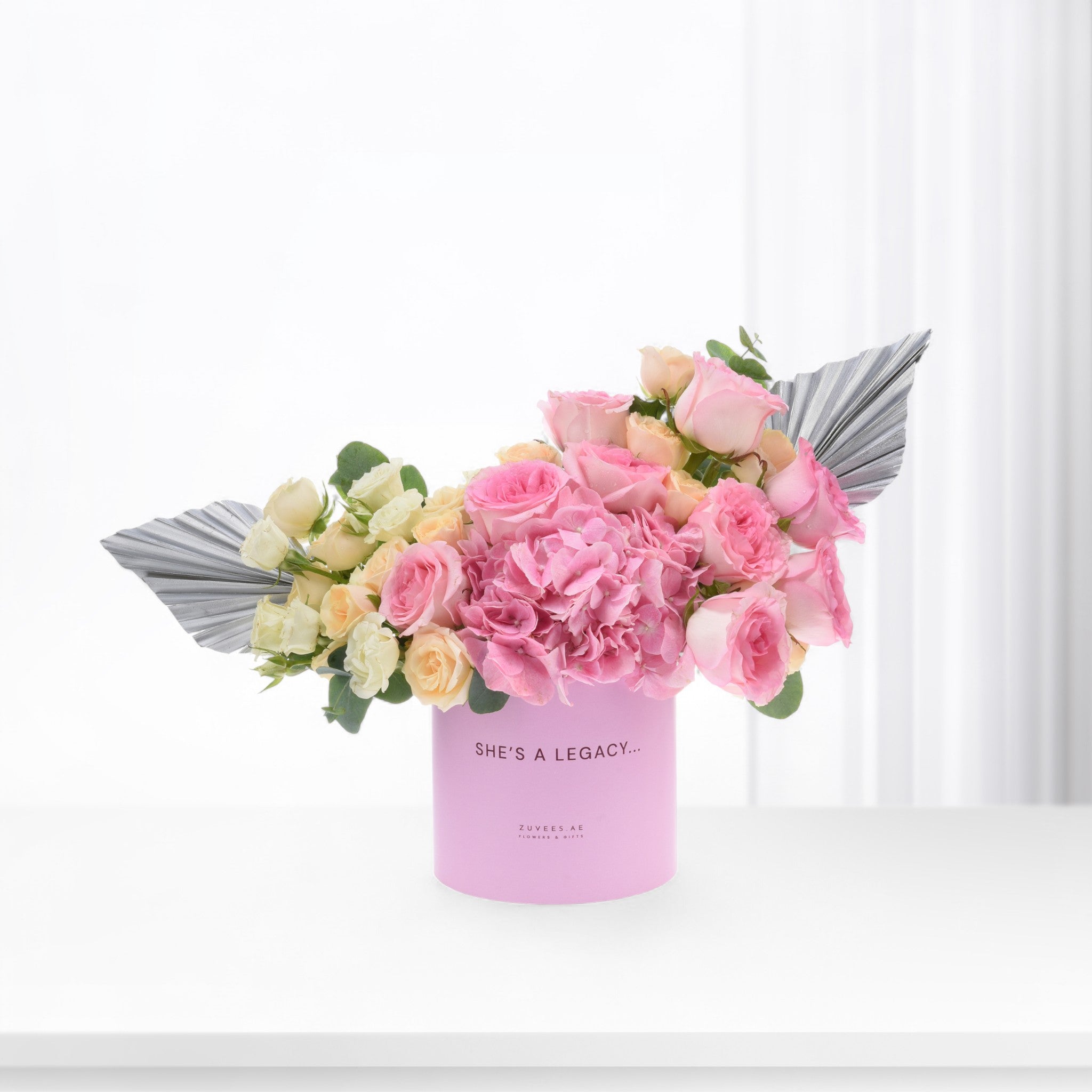 Pink hydrangeas, blush roses in lavender box with "She&