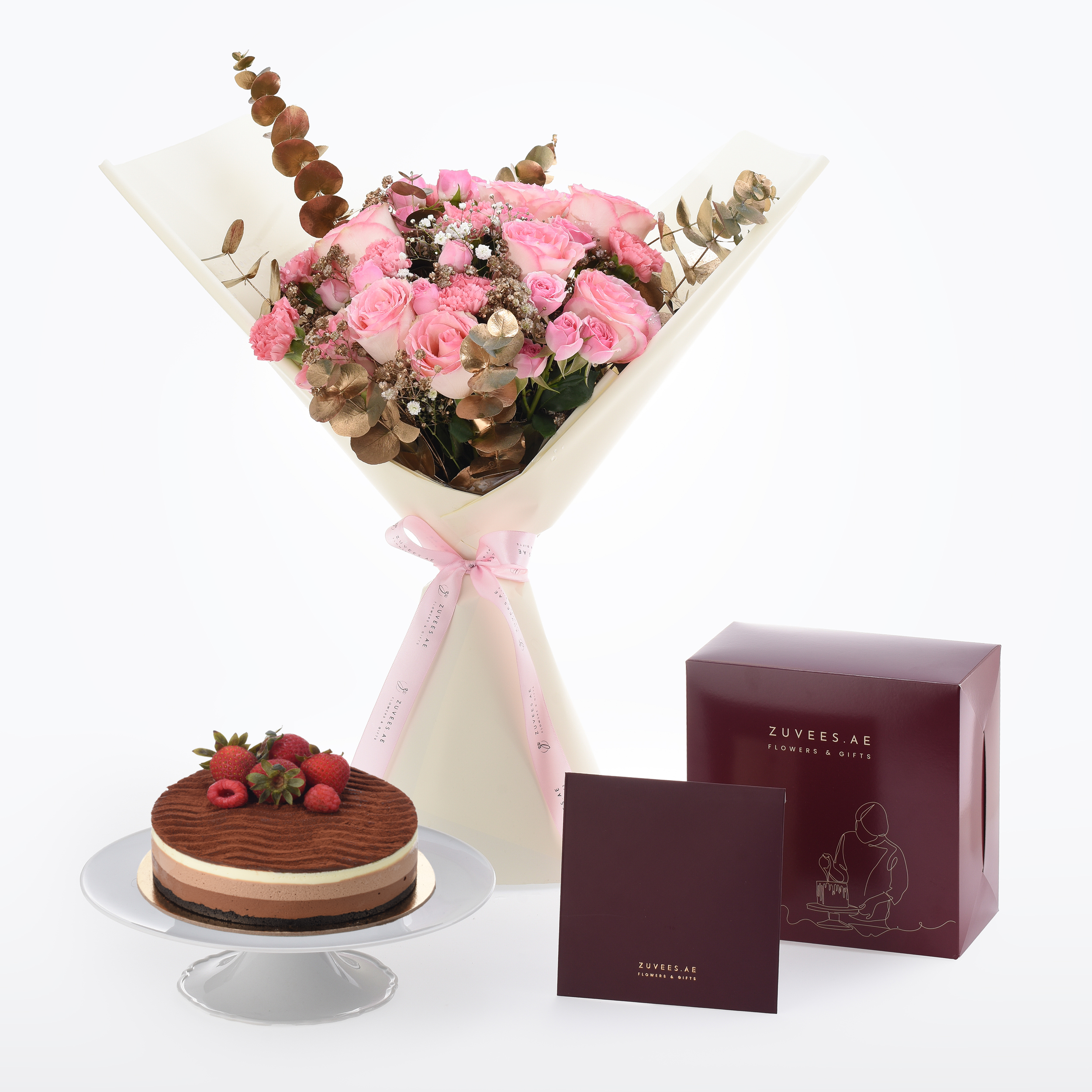 Pink roses bouquet with gold eucalyptus, chocolate cake, burgundy gift boxes, elegant white wrap, pink ribbon.