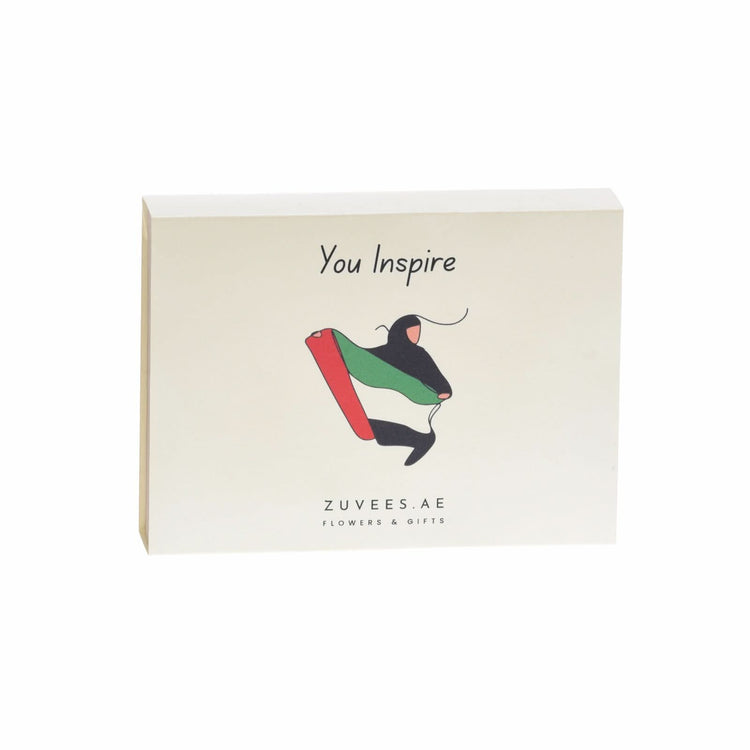 Cream gift box with "You Inspire" text and UAE flag motif illustration.