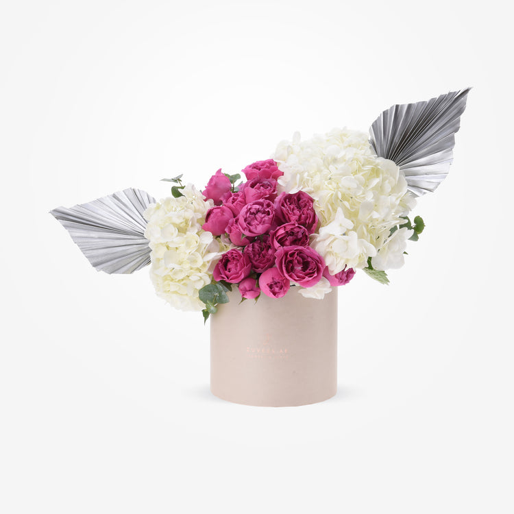 Elegant pink peonies, white hydrangeas, silver palm leaves in chic beige Zuvees box.