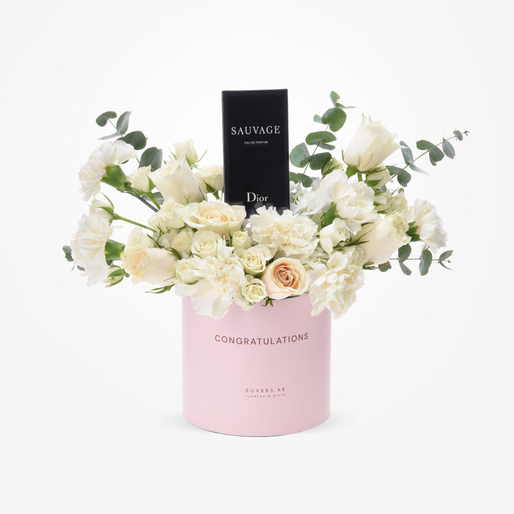Elegant white roses and eucalyptus in pink "Congratulations" box with Dior Sauvage perfume.