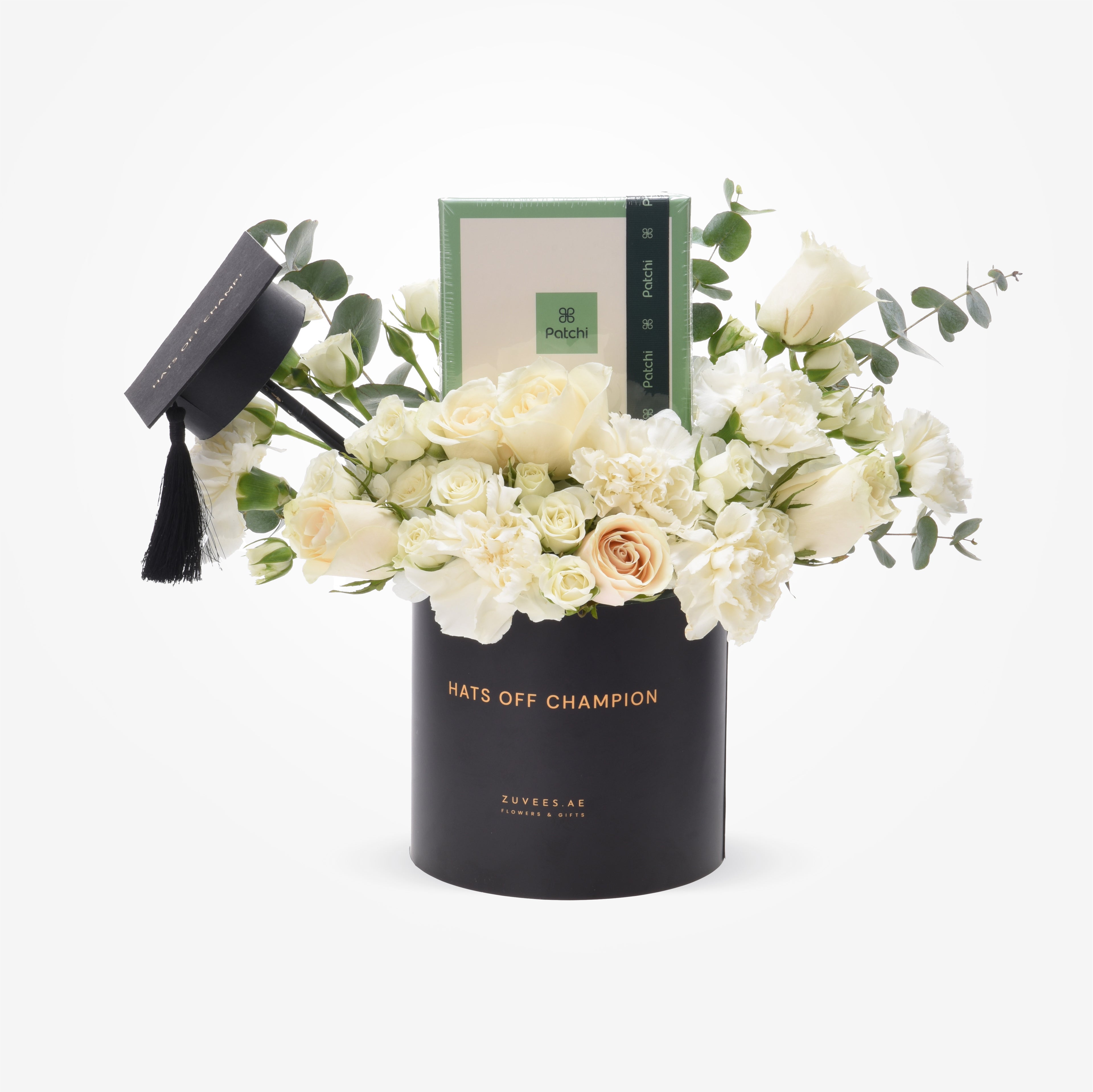 Elegant white roses and carnations in black graduation-themed vase with “Hats Off Champion” text.