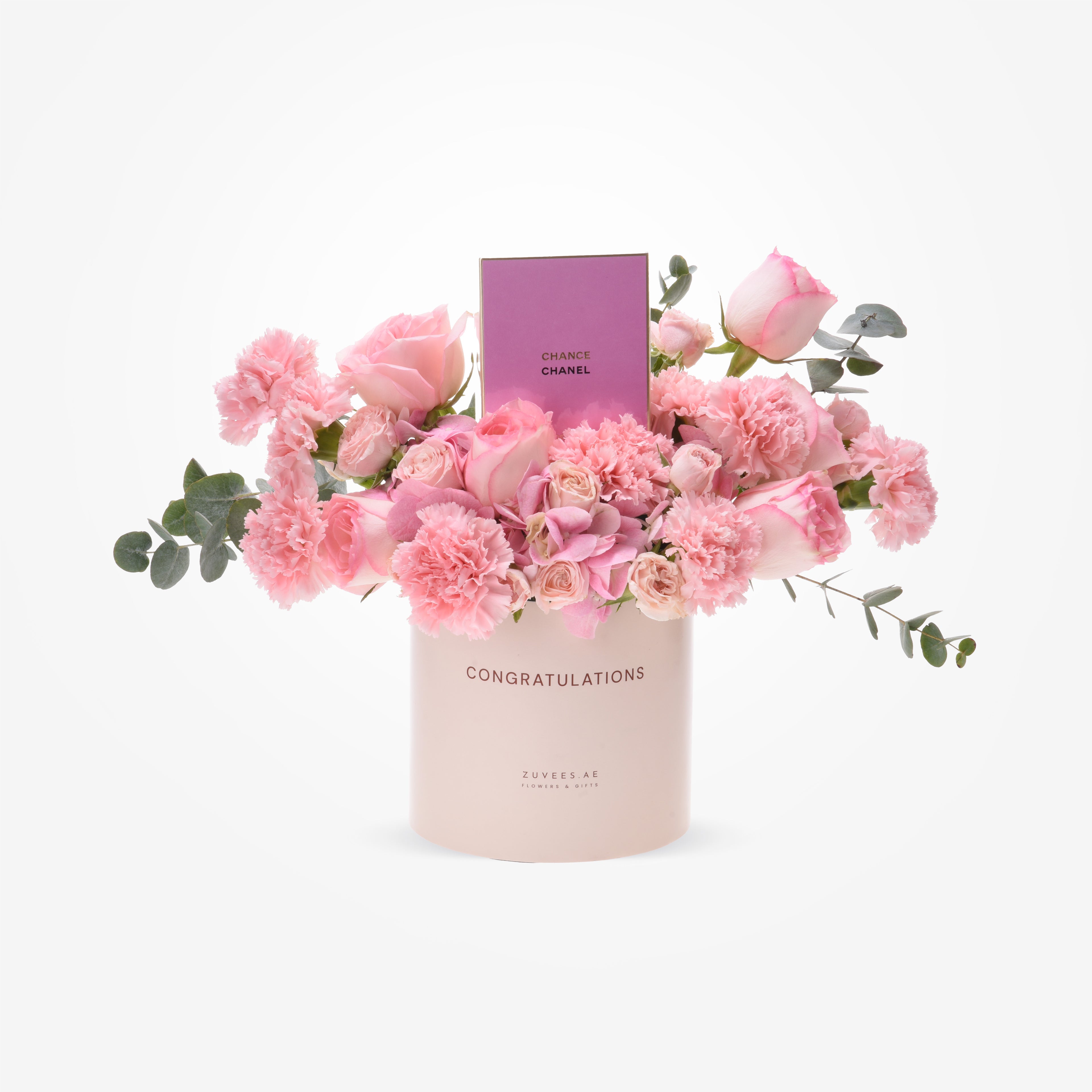 Soft pink roses and carnations in blush box with "Congratulations" and Chanel perfume.