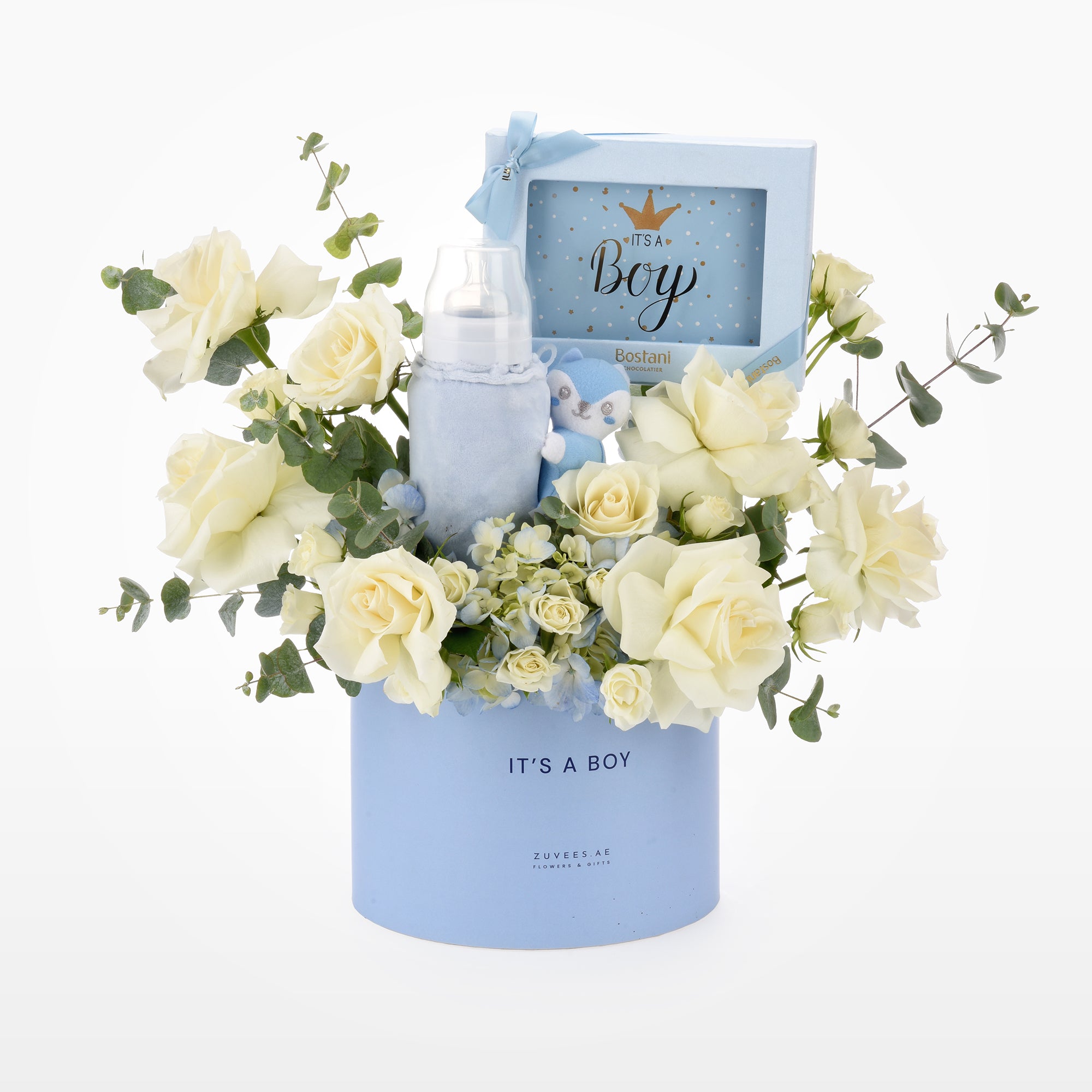 Soft blue baby-themed gift basket with creamy roses and plush toy.