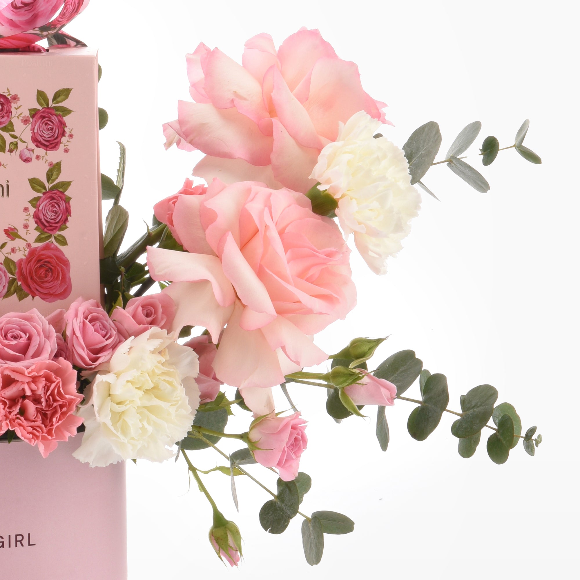 Pink roses and white carnations with eucalyptus in a floral gift box.