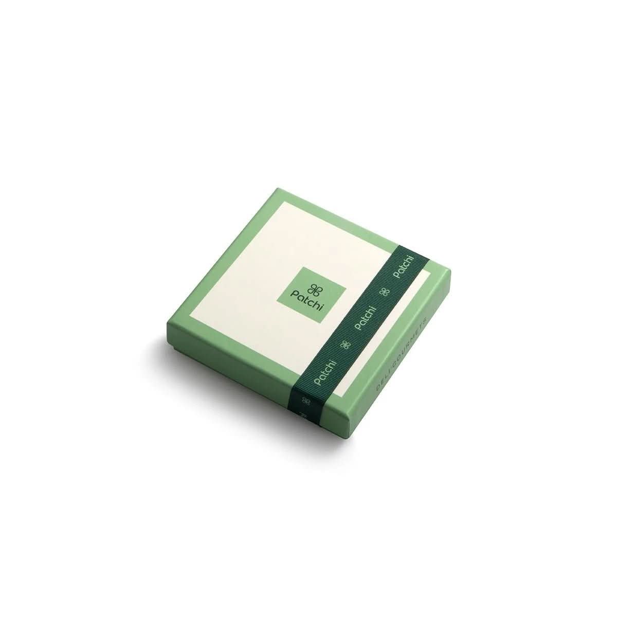 Minimalist green Patchi chocolate box with elegant ribbon and clean typography.