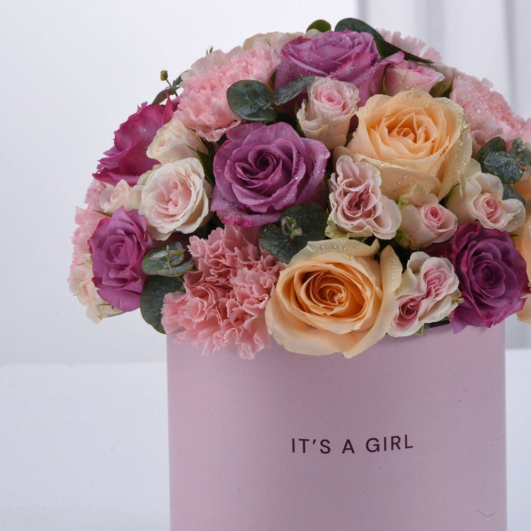 Pink and purple roses with carnations in a "It&
