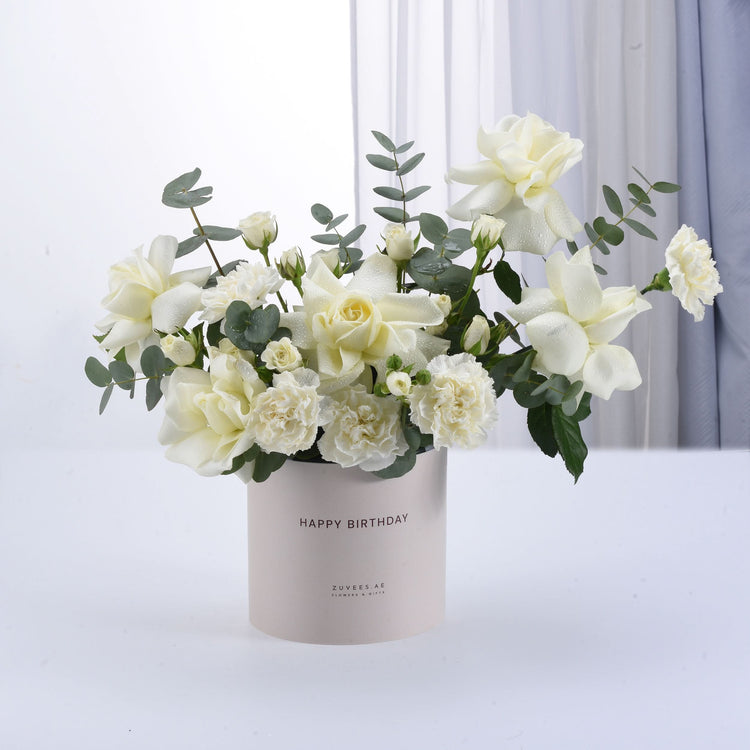 White roses and carnations in beige "Happy Birthday" gift box.