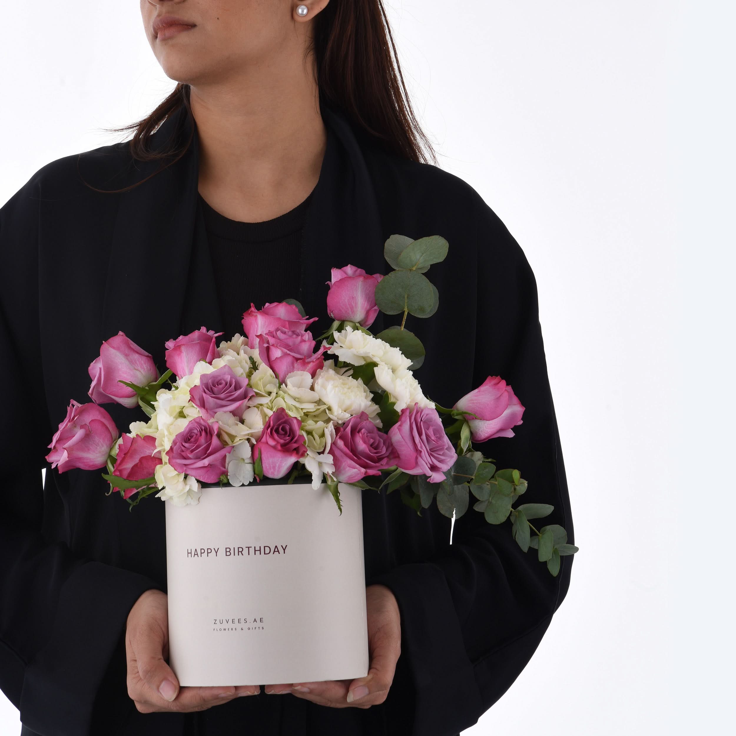 Elegant birthday bouquet in white box, pink roses, white hydrangeas, eucalyptus.