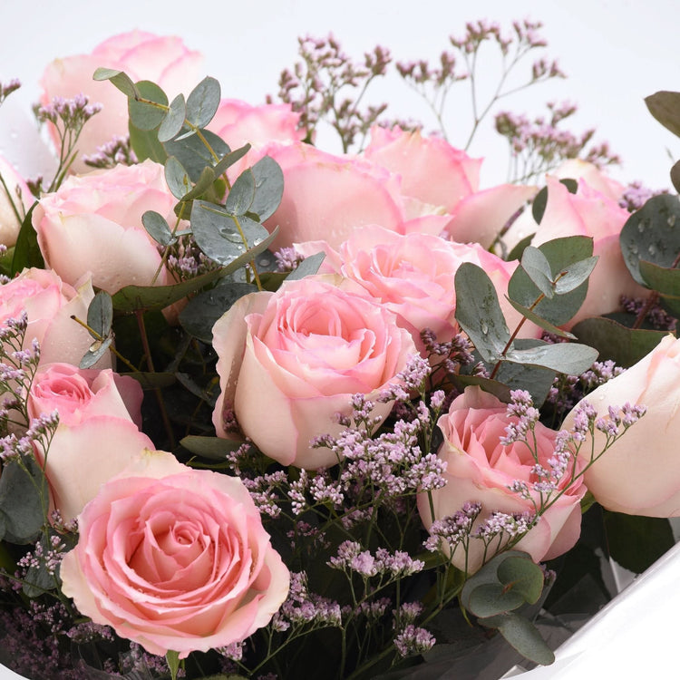 Soft pink roses, eucalyptus, and baby&