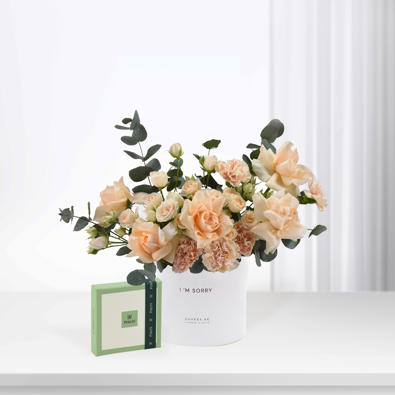 Soft peach roses & eucalyptus in white "I&