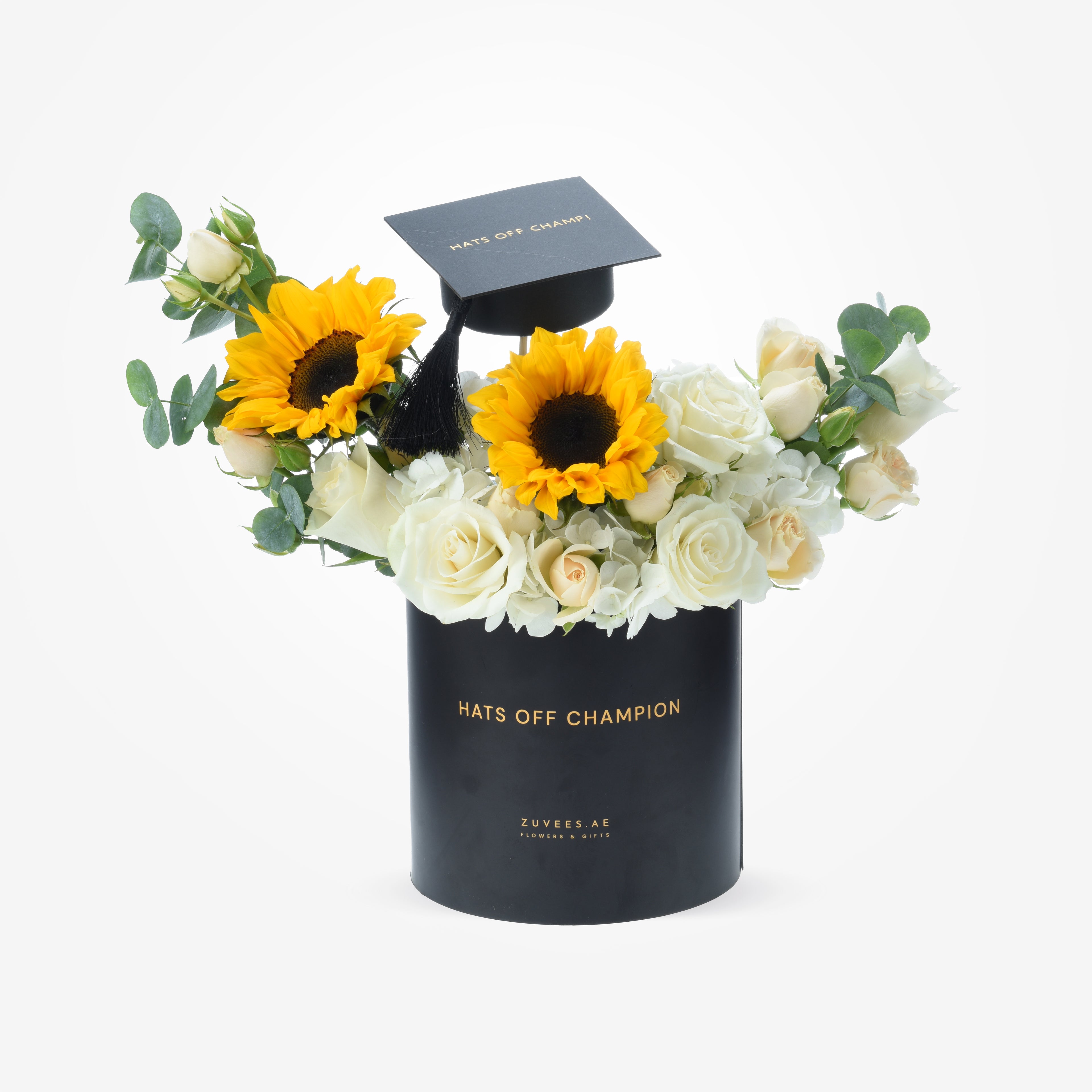 Black "Hats Off Champion" box with sunflowers, white roses, and a graduation cap.