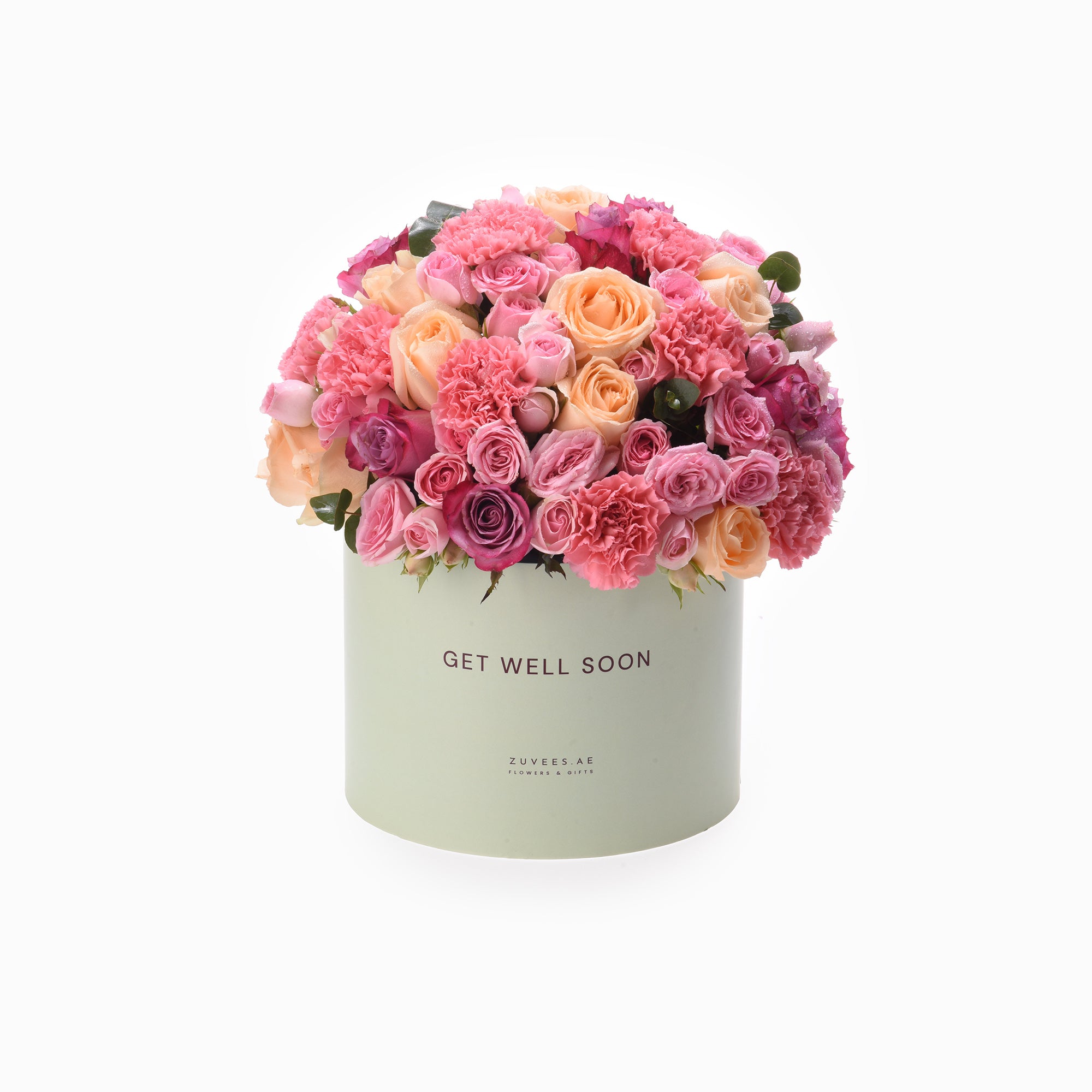 Pastel pink roses and carnations bloom in mint-green "Get Well Soon" box.