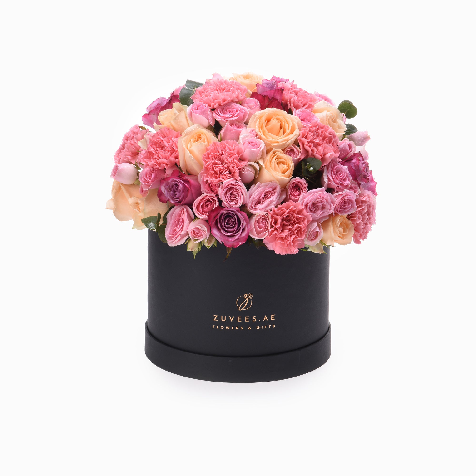 Luxurious pink rose and carnation bouquet in matte black box with gold logo.
