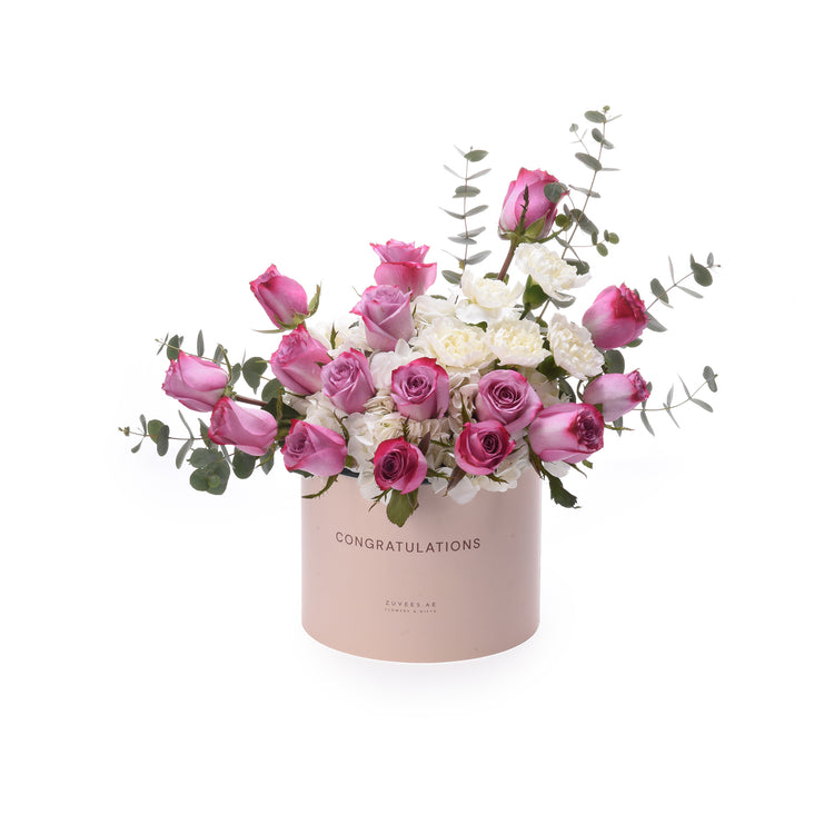 Pink and white roses in blush box with "Congratulations" text.