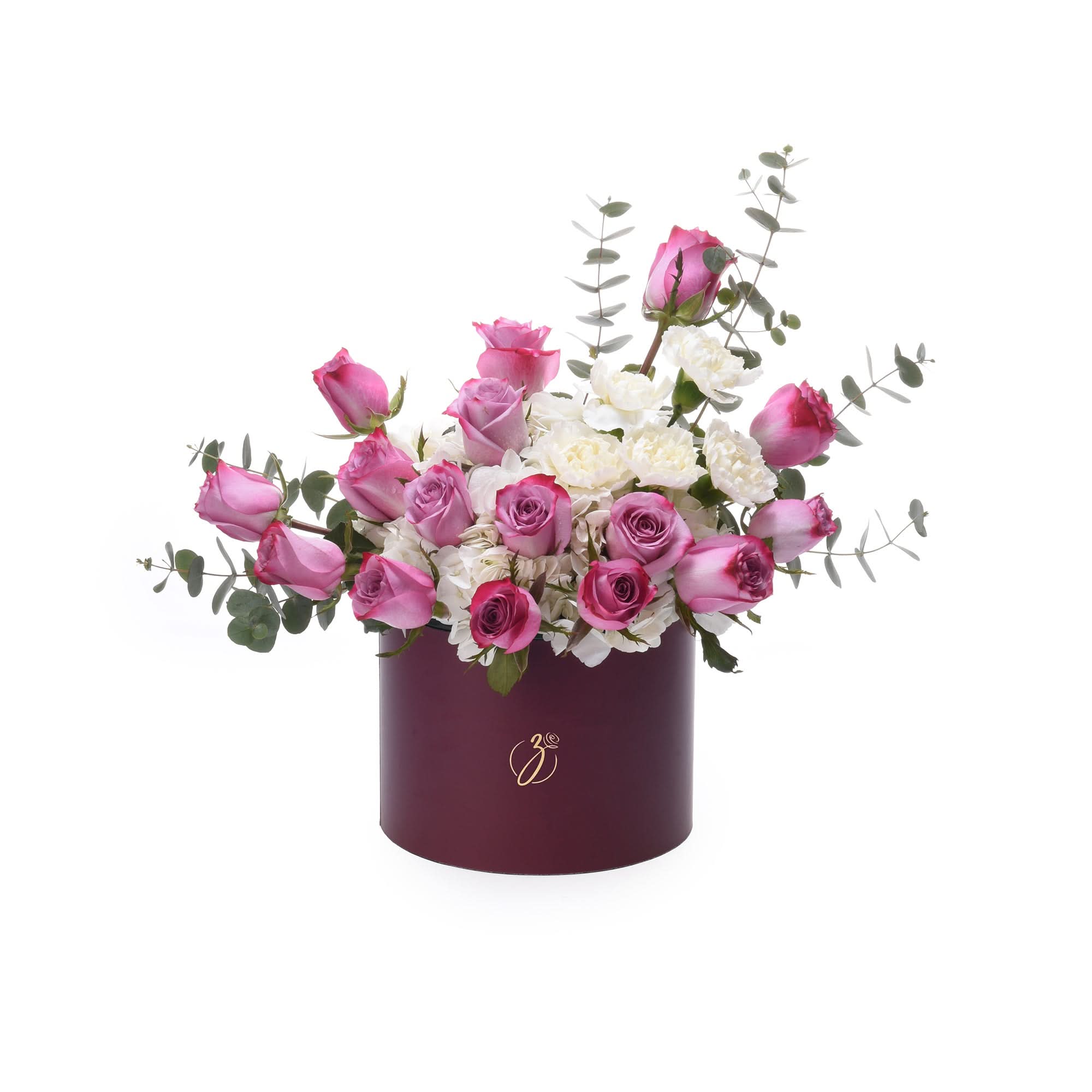 Elegant burgundy hat box filled with pink roses and white blooms, accented with eucalyptus.