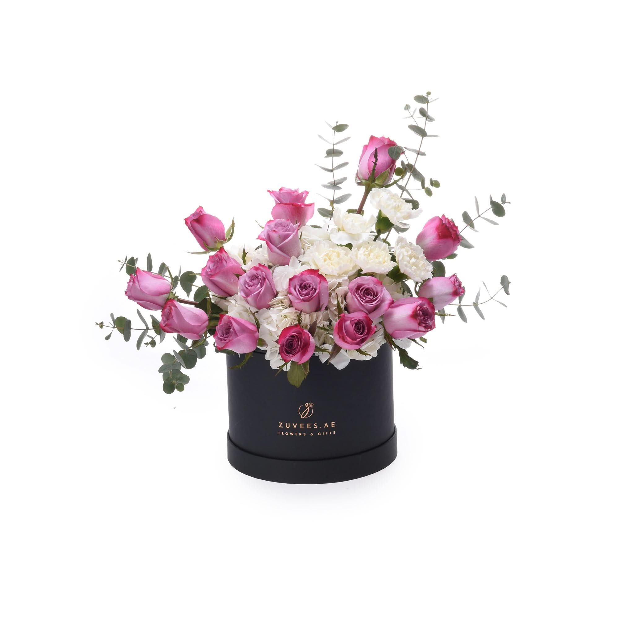 Elegant black hat box filled with pink roses and white hydrangeas, accented with eucalyptus.