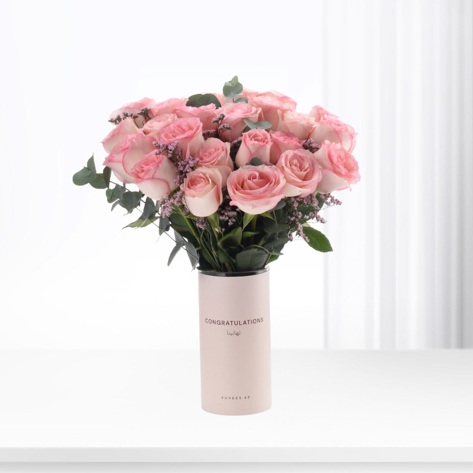 Soft pink roses in minimalist vase, “Congratulations” text, elegant celebration bouquet.