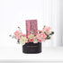 Elegant black box with "Happy Anniversary" holds soft pink, white roses and eucalyptus, accented by a pink cherry blossom gift tag.