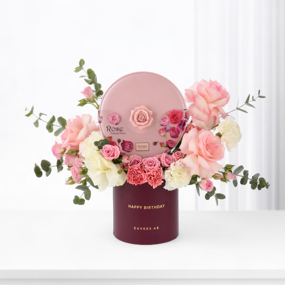 Pink rose bouquet in burgundy box with "Happy Birthday" text.