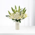 White lilies, hydrangeas, and buds in minimalist vase with "Get Well Soon" message.
