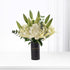 Elegant white lilies, hydrangeas in sleek black "Happy Anniversary" vase, minimalist modern design.