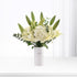 White vase holds creamy lilies, hydrangeas, and buds; minimalist, elegant apology bouquet.