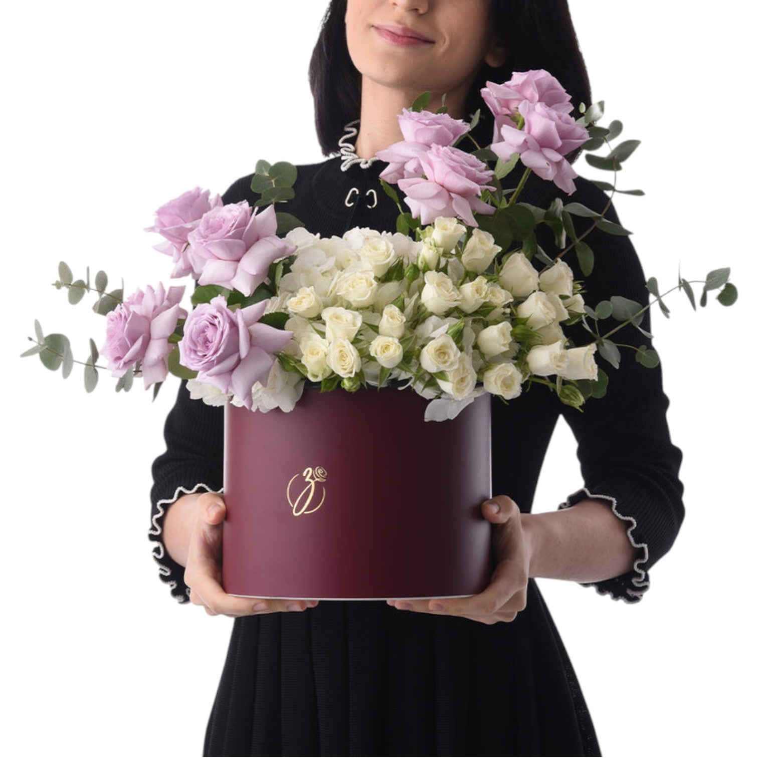 Elegant burgundy hat box holds lush lavender and ivory roses with eucalyptus.
