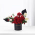 Elegant black vase with red and white roses, "Happy Anniversary" text, modern design.