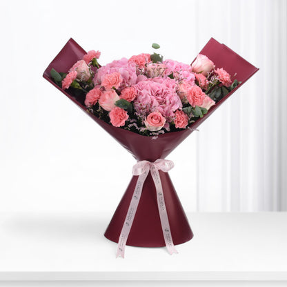 Pink roses, carnations, and baby&