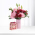 Pink vase with red roses, hydrangeas, and lilies; "It&