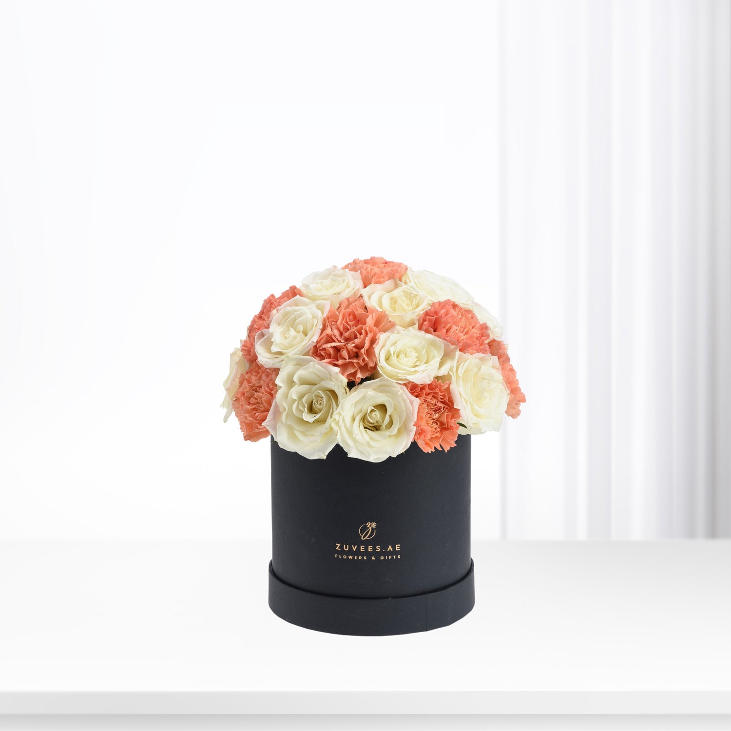 Elegant coral and ivory roses &amp; carnations in matte black box.