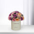 Pastel pink, purple, and peach roses in cream box reading "Thank You".