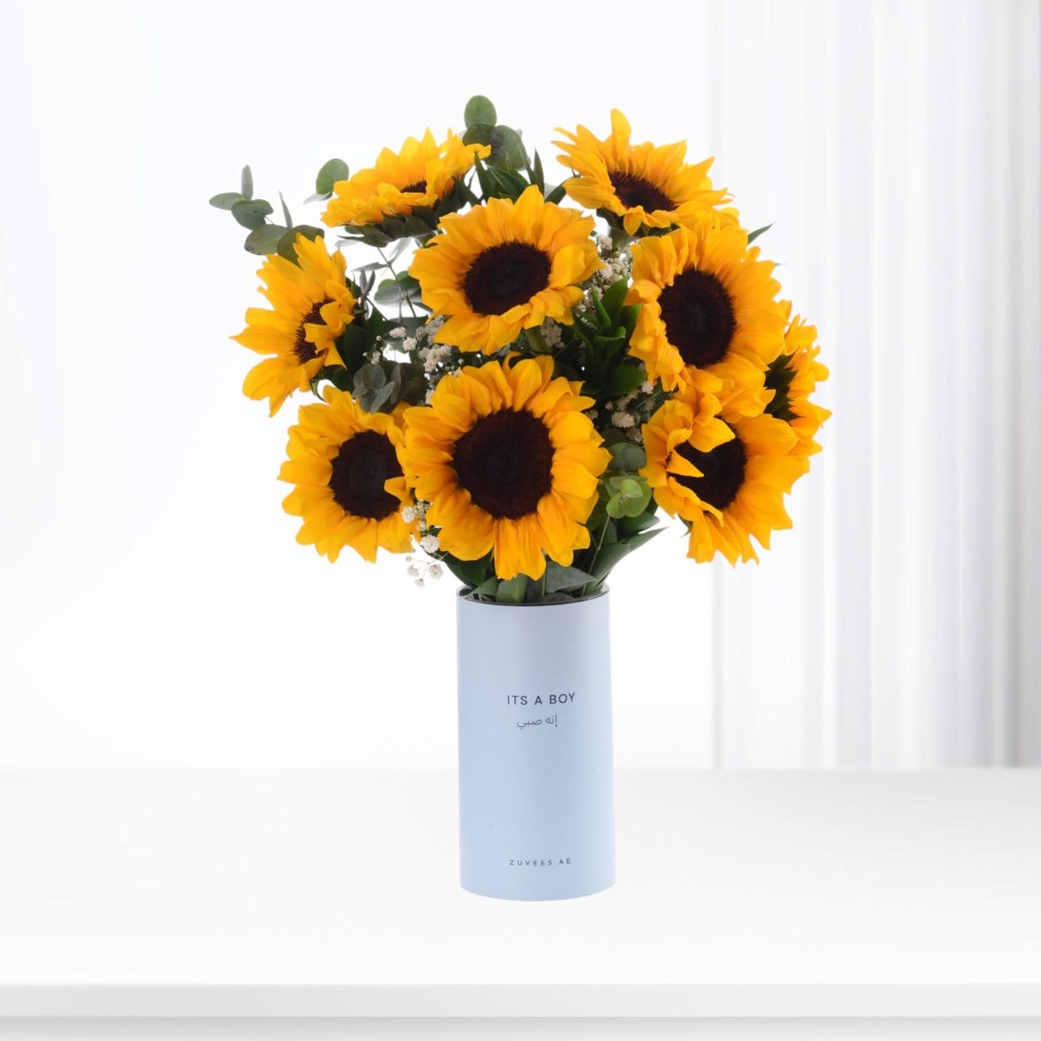 Vibrant sunflowers in light blue "It&