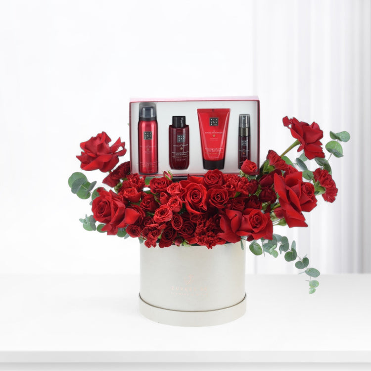 Luxurious red rose bouquet with Ayurveda spa gift set in elegant white box.