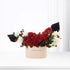 Red roses, white blooms, black accents in cream "Happy Birthday" box, minimalist elegance.
