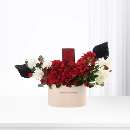 Elegant red and white roses in beige box with "Happy Birthday" and Dior perfume.