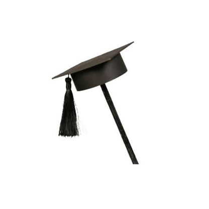 Black graduation cap on stick, tassel dangling, minimalist studio shot.