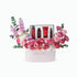 Pink floral arrangement with luxury skincare set, "Congratulations" gift box.