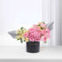Elegant pink roses and hydrangeas in black box with "Happy Anniversary" gold text.