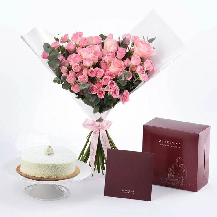 Pink roses bouquet with white cake and burgundy gift box.